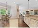 Open kitchen with granite countertops overlooking breakfast area with natural light at 11727 Dunham Dr, Matthews, NC 28105