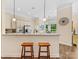 Modern kitchen featuring stainless steel appliances, granite countertops, and breakfast bar seating at 11727 Dunham Dr, Matthews, NC 28105