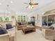 Inviting living area featuring a cozy seating arrangement, large windows, and stylish decor at 11727 Dunham Dr, Matthews, NC 28105