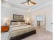 Spacious main bedroom with en-suite bathroom featuring a walk-in shower and soaking tub at 11727 Dunham Dr, Matthews, NC 28105
