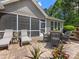 Covered patio featuring seating, lounge chairs and manicured landscaping at 11727 Dunham Dr, Matthews, NC 28105