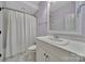Well-lit bathroom features a white vanity, neutral walls, and ample space for a relaxing experience at 128 Spears Creek Dr, Mooresville, NC 28117