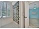 Bathroom featuring a shower with decorative curtains and natural light from the adjacent bedroom at 128 Spears Creek Dr, Mooresville, NC 28117