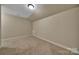 Bedroom with neutral carpet and paint, closet, and angled ceiling at 128 Spears Creek Dr, Mooresville, NC 28117