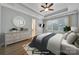 This bedroom features natural lighting, tray ceilings, and hardwood floors at 128 Spears Creek Dr, Mooresville, NC 28117