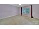 Bedroom with neutral decor, plush carpeting, natural light, and modern feel offers space and comfort at 128 Spears Creek Dr, Mooresville, NC 28117