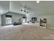 Large bonus room with built-in shelving and storage, media center, and carpet at 128 Spears Creek Dr, Mooresville, NC 28117