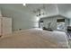 Expansive bonus room with neutral decor, ceiling fan and natural light--perfect for workouts or relaxation at 128 Spears Creek Dr, Mooresville, NC 28117