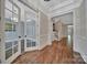 Elegant foyer with hardwood floors and decorative wainscoting, leading to various rooms at 128 Spears Creek Dr, Mooresville, NC 28117