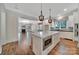 Gourmet kitchen featuring a large island with seating and modern appliances, perfect for entertaining at 128 Spears Creek Dr, Mooresville, NC 28117