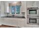 Kitchen with stainless steel appliances, black countertops and bright window at 128 Spears Creek Dr, Mooresville, NC 28117