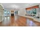 Bright living room with hardwood floors, fireplace, French doors, and window seat at 128 Spears Creek Dr, Mooresville, NC 28117
