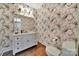 Stylish powder room featuring designer wallpaper, a chic vanity, and modern fixtures at 128 Spears Creek Dr, Mooresville, NC 28117