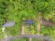 Birds-eye view of the home, surrounded by mature trees, sits on a well-manicured lot and paved road at 131 Little Forest Ln, Statesville, NC 28625