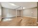 Large basement with light walls and hardwood floors at 131 Little Forest Ln, Statesville, NC 28625