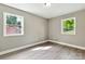 Bedroom with light walls and two windows providing ample natural light at 131 Little Forest Ln, Statesville, NC 28625