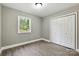 Bedroom with light walls, a window and a closet at 131 Little Forest Ln, Statesville, NC 28625