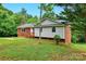 Lovely single-story home with brick and siding exterior, a front porch, and a well-maintained lawn at 131 Little Forest Ln, Statesville, NC 28625