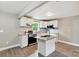 Modern kitchen with white cabinetry, stainless steel appliances, and an island for added workspace at 131 Little Forest Ln, Statesville, NC 28625