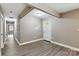 A spacious entryway with wood-look flooring and neutral paint leads to other areas of the home at 131 Little Forest Ln, Statesville, NC 28625