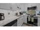 Modern kitchen with granite countertops, stainless steel appliances, and stylish subway tile backsplash at 1608 Sharon W Rd # 55, Charlotte, NC 28210