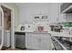 Updated kitchen boasts granite counters, subway tile, stainless appliances, and ample cabinet space at 1608 Sharon W Rd # 55, Charlotte, NC 28210