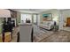 Bright and airy living room featuring stylish furniture, large rug, and neutral wall color at 1608 Sharon W Rd # 55, Charlotte, NC 28210