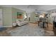 Light and bright living room with fireplace, view into kitchen and dining area at 1608 Sharon W Rd # 55, Charlotte, NC 28210