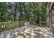 Wooden back deck overlooking a wooded area at 1614 Tarrington Way, Indian Trail, NC 28079