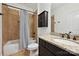 Bathroom featuring a tub-shower combo and single vanity with granite countertop at 1614 Tarrington Way, Indian Trail, NC 28079