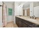 Bathroom with granite countertops, double sinks, wood cabinets, and a shower-tub combination at 1614 Tarrington Way, Indian Trail, NC 28079