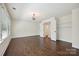 Spacious bedroom with dark wood floors, large windows, and access to a closet at 1614 Tarrington Way, Indian Trail, NC 28079
