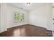 Cozy bedroom with hardwood floors, a bright window, and a simple design at 1614 Tarrington Way, Indian Trail, NC 28079