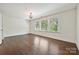 Well-lit bedroom with hardwood floors, neutral walls, and recessed lighting at 1614 Tarrington Way, Indian Trail, NC 28079