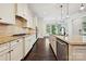 Kitchen with stainless appliances, white cabinets, granite countertops, and island at 1614 Tarrington Way, Indian Trail, NC 28079