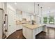 Kitchen featuring stainless appliances, granite counters, and island with modern pendant lighting at 1614 Tarrington Way, Indian Trail, NC 28079