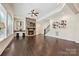 Living room with stone fireplace, hardwood floors, and modern decor at 1614 Tarrington Way, Indian Trail, NC 28079