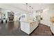 Living room with hardwood floors, fireplace, and open access to the adjacent kitchen area at 1614 Tarrington Way, Indian Trail, NC 28079