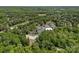 Aerial view showcasing community amenities including a pool, tennis courts, and golf course at 17924 River Ford Dr, Davidson, NC 28036