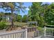 Backyard featuring a built-in outdoor kitchen, bar seating, and manicured lawn at 17924 River Ford Dr, Davidson, NC 28036