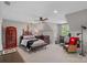 Bedroom with vaulted ceiling, decorative wall art, and a glass desk at 17924 River Ford Dr, Davidson, NC 28036