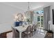 Charming dining room featuring decorative light fixture, large windows, and luxury finishes at 17924 River Ford Dr, Davidson, NC 28036