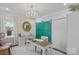Bright home office features a stylish chandelier, a window, and green sliding doors at 17924 River Ford Dr, Davidson, NC 28036
