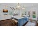 Open concept kitchen with large island, pendant lighting, stainless appliances, and hardwood floors at 17924 River Ford Dr, Davidson, NC 28036