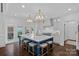 Open concept kitchen with large island, pendant lighting, stainless appliances, and hardwood floors at 17924 River Ford Dr, Davidson, NC 28036