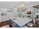 Open concept kitchen with large island, pendant lighting, stainless appliances, and hardwood floors at 17924 River Ford Dr, Davidson, NC 28036