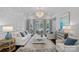 Stylish living room has elegant decor, fireplace and large windows that let in natural light at 17924 River Ford Dr, Davidson, NC 28036