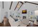 Open concept living room with vaulted ceiling, fireplace, and hardwood floors at 17924 River Ford Dr, Davidson, NC 28036