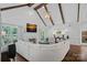 Open concept living room with vaulted ceiling, fireplace, and hardwood floors at 17924 River Ford Dr, Davidson, NC 28036
