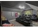 Home theater featuring tiered seating, custom lighting, and a movie-themed decor at 17924 River Ford Dr, Davidson, NC 28036